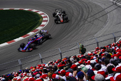 Pierre Gasly, Toro Rosso STR13, leads Romain Grosjean, Haas F1 Team VF-18