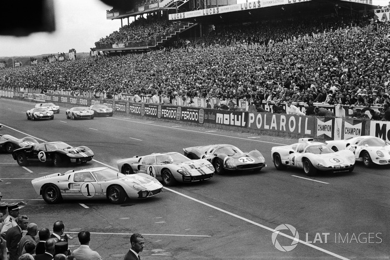 #1 Ken Miles, is getting jumped at the start by John Whitmore's Ford #8, Mike Parkes' Ferrari #20, J