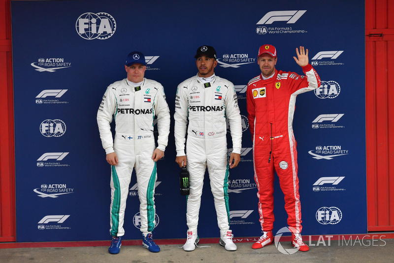 Valtteri Bottas, Mercedes-AMG F1,pole sitter Lewis Hamilton, Mercedes-AMG F1 and Sebastian Vettel, Ferrari celebrate in parc ferme