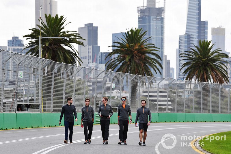 Lando Norris, McLaren, walks the track with his team