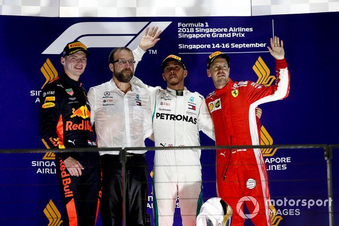 Max Verstappen, Red Bull Racing, 2nd position, the Mercedes Constructors Trophy delegate, Lewis Hamilton, Mercedes AMG F1, 1st position, and Sebastian Vettel, Ferrari, 3rd position, on the podium