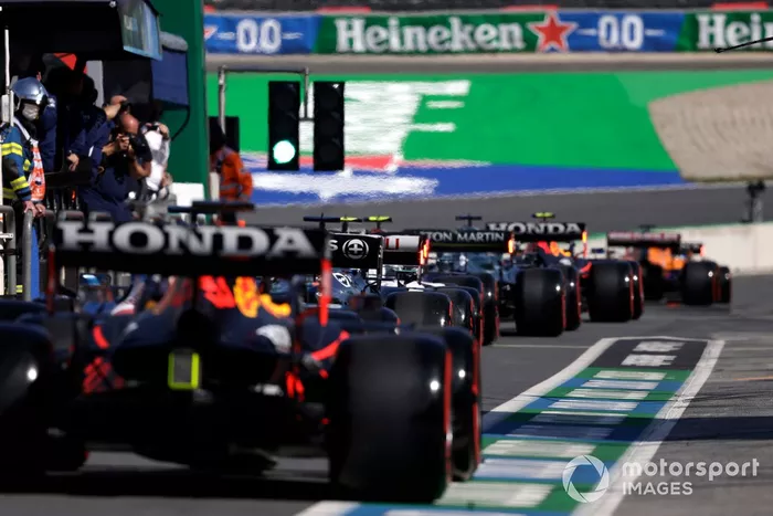Lewis Hamilton, Mercedes W12, and Max Verstappen, Red Bull Racing RB16B, in the pit lane