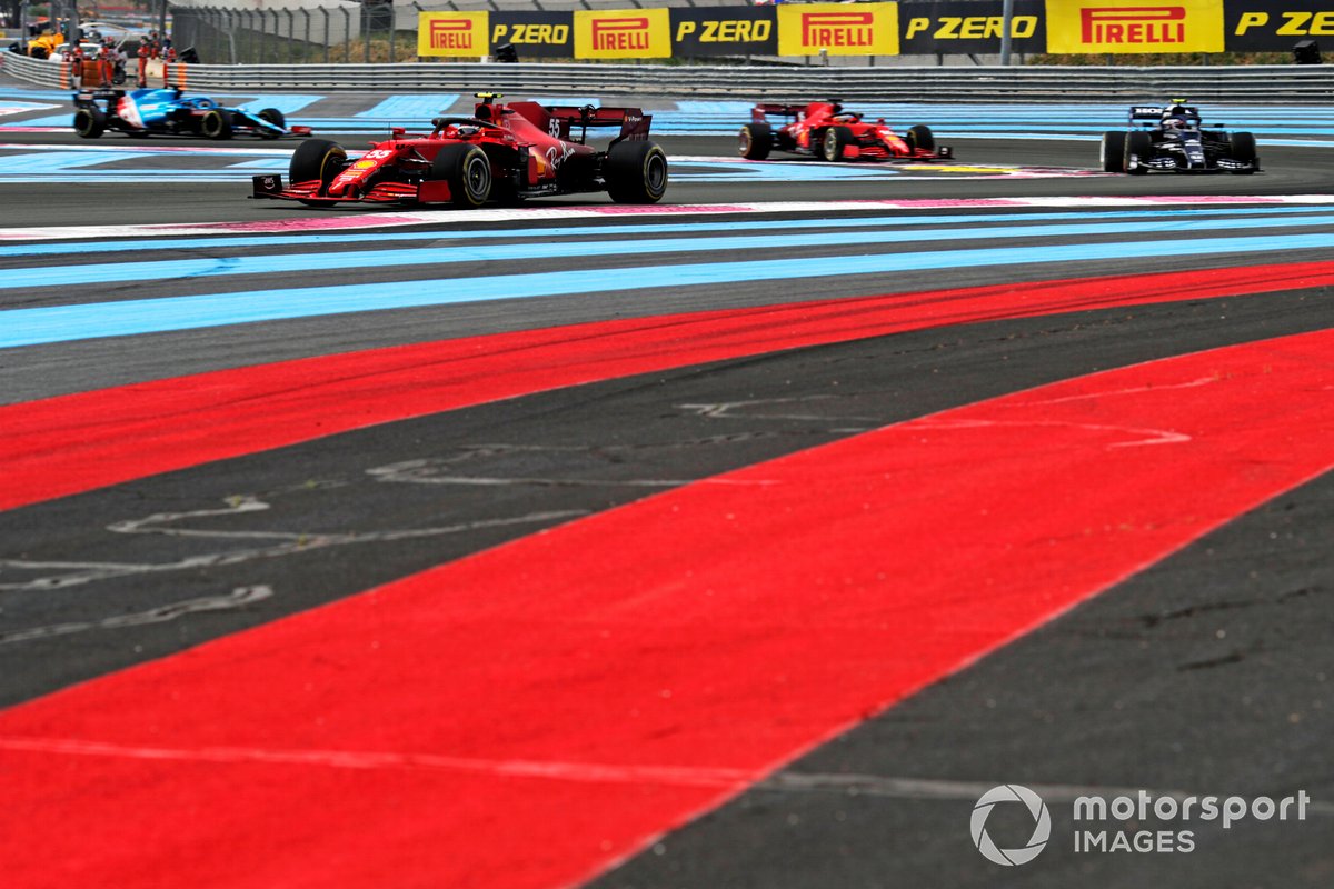 Carlos Sainz, Ferrari SF21 , leads Pierre Gasly, AlphaTauri AT02, and Charles Leclerc, Ferrari SF21