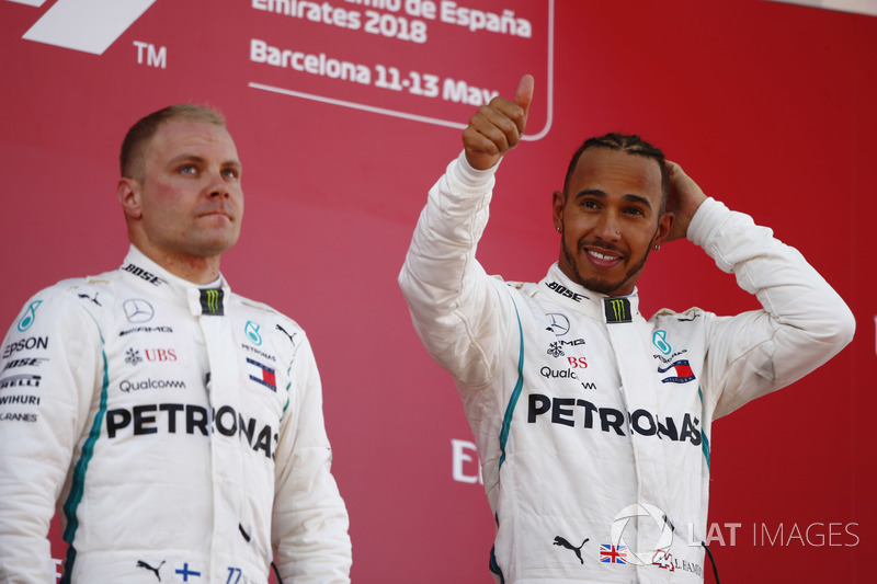 Lewis Hamilton, Mercedes AMG F1, celebrates victory on the podium with Valtteri Bottas, Mercedes AMG F1