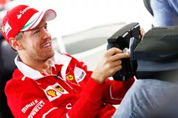  Sebastian Vettel, Ferrari, plays a computer game