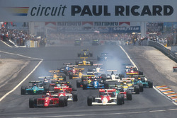 Nigel Mansell, Ferrari 641 leads Gerhard Berger, McLaren MP4/5B Honda, Ayrton Senna, McLaren MP4/5B Honda, Alessandro Nannini, Benetton B190 Ford, Alain Prost, Ferrari 641, Riccardo Patrese, Williams FW13B Renault and Ivan Capelli, Leyton House CG901 Judd
