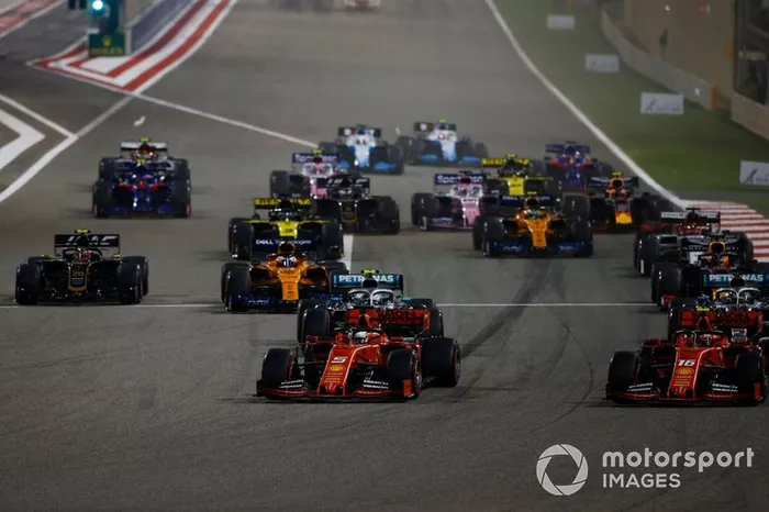 Sebastian Vettel, Ferrari SF90, Charles Leclerc, Ferrari SF90, Lewis Hamilton, Mercedes AMG F1 W10, Valtteri Bottas, Mercedes AMG W10, Max Verstappen, Red Bull Racing RB15, Kevin Magnussen, Haas F1 Team VF-19, and the rest of the field at the start