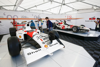 Fans admire historic McLaren and BAR Honda-powered cars.