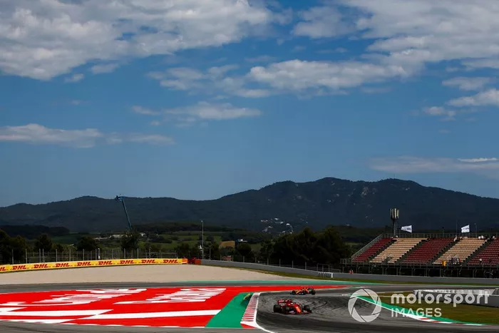 Sebastian Vettel, Ferrari SF90, Carlos Sainz Jr., McLaren MCL34