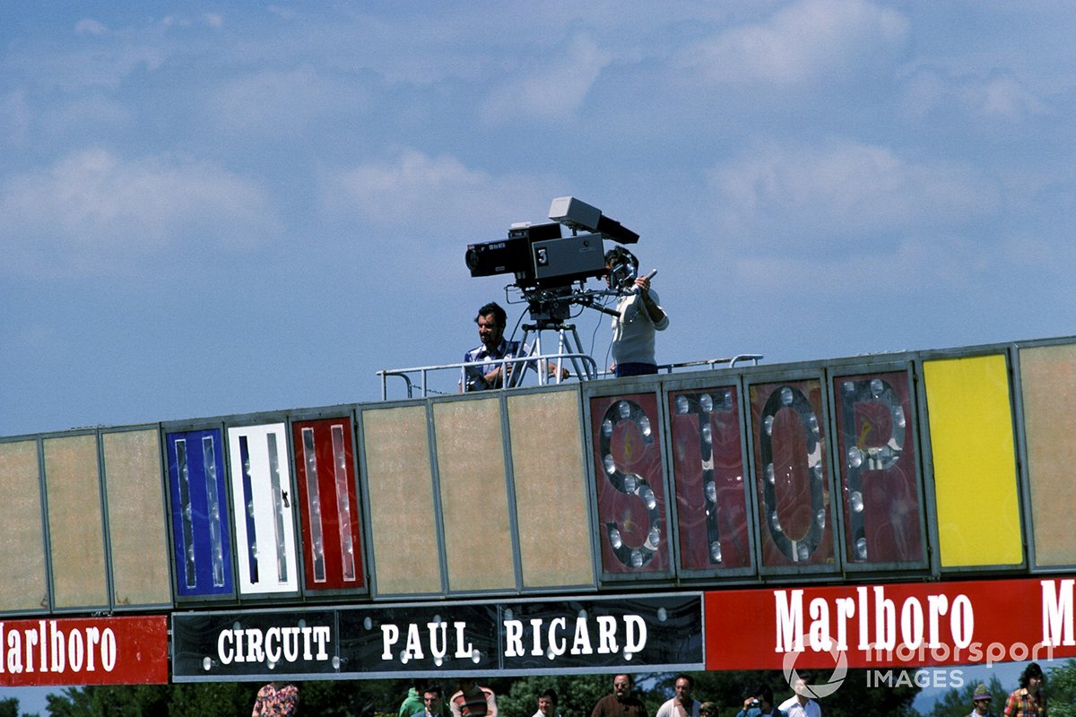 A television cameraman prepares to film the race from the gantry above the start/finish line