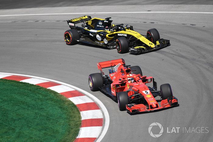 Sebastian Vettel, Ferrari SF71H y Nico Hulkenberg, Renault Sport F1 Team R.S. 18