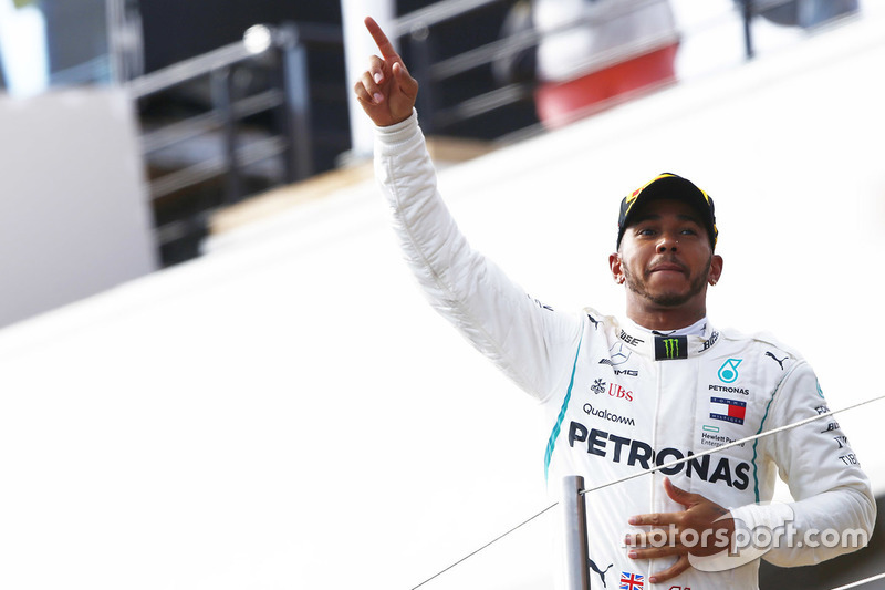 Lewis Hamilton, Mercedes AMG F1, celebrates on the podium after winning the race