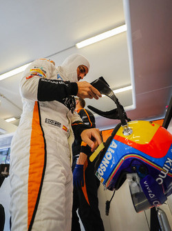 Fernando Alonso, McLaren, puts his helmet on
