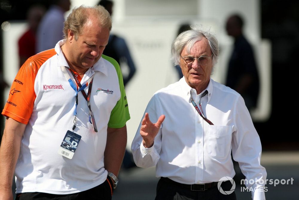 Bernie Ecclestone (GBR) F1 Supremo talks with Robert Fernley (GBR) Force India F1 team principal