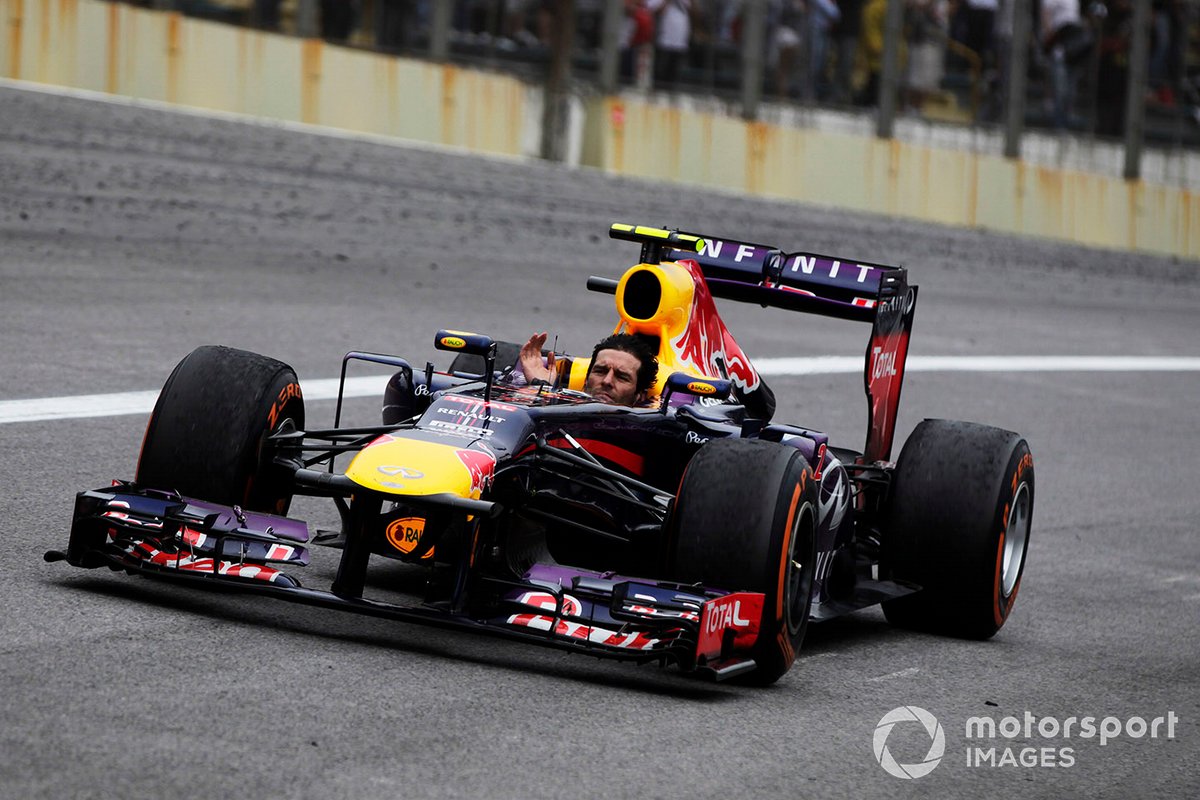 Mark Webber, Red Bull RB9 Renault tours minus his helmet after completing his last race in F1