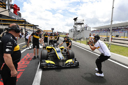 Aseel Al-Hamad, prepares to drive a 2012 Lotus E20 Renault F1 car in the Renault Passion Parade