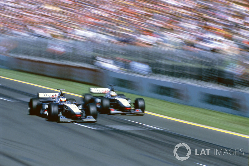 Mika Hakkinen passes David Coulthard McLaren MP4/13