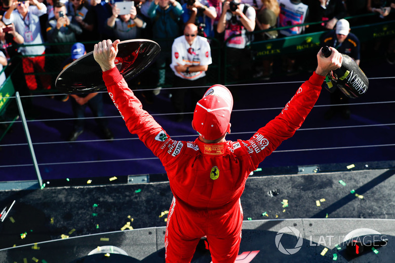 Race winner Sebastian Vettel, Ferrari, with his trophy and Champagne