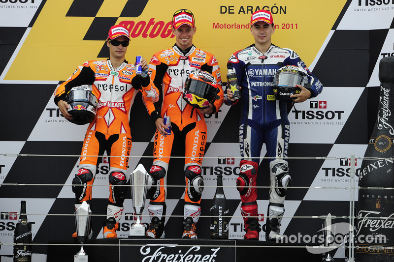 Podium: Race winner Casey Stoner, Respsol Honda; second place Dani Perdrosa, Repsol Honda; third pla