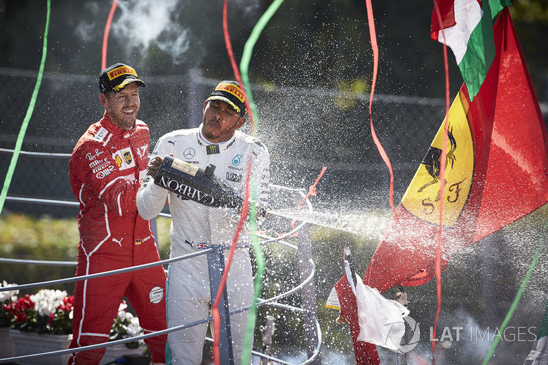 Race winner Third place Lewis Hamilton, Mercedes AMG F1 Sebastian Vettel, Ferrari, pour Champagne from the podium