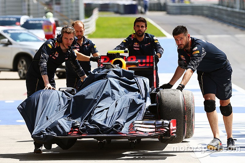 The Red Bull Racing RB12 of Max Verstappen, Red Bull Racing is recovered back to the pits in the fir