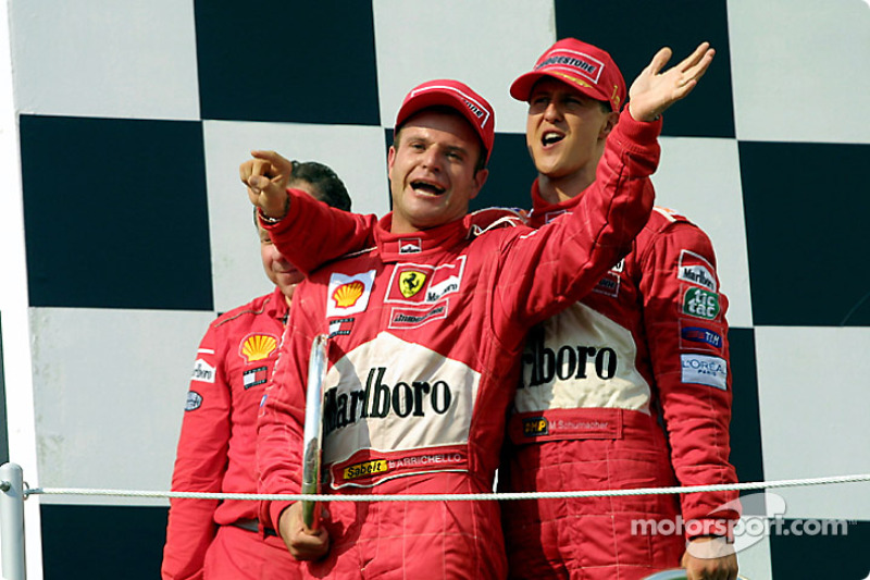 Jean Todt, Rubens Barrichello and Michael Schumacher on the podium