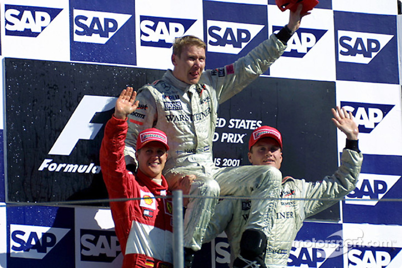 The podium: race winner Mika Hakkinen with Michael Schumacher and David Coulthard