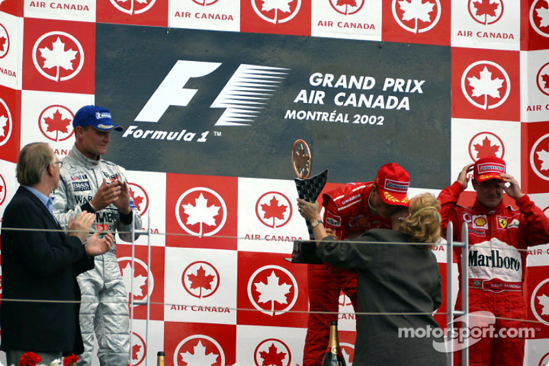 The podium: race winner Michael Schumacher with David Coulthard and Rubens Barrichello