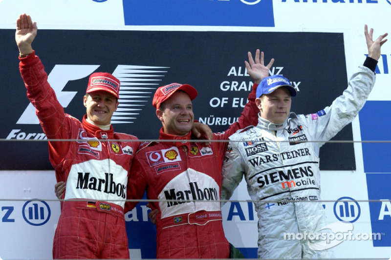 The podium: race winner Rubens Barrichello with Michael Schumacher and Kimi Raikkonen