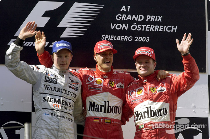 The podium: race winner Michael Schumacher with Kimi Raikkonen and Rubens Barrichello