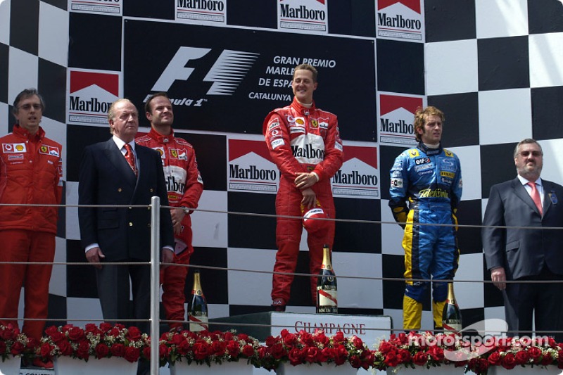 Podium: winnaar Michael Schumacher met Rubens Barrichello en Jarno Trulli