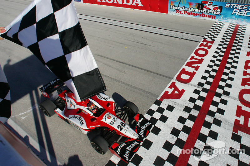 Dan Wheldon takes the checkered flag