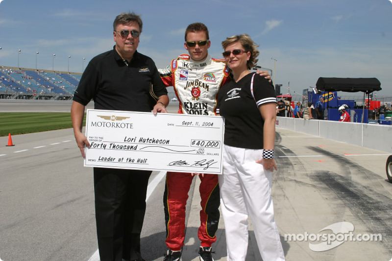 Dan Wheldon accepts a check