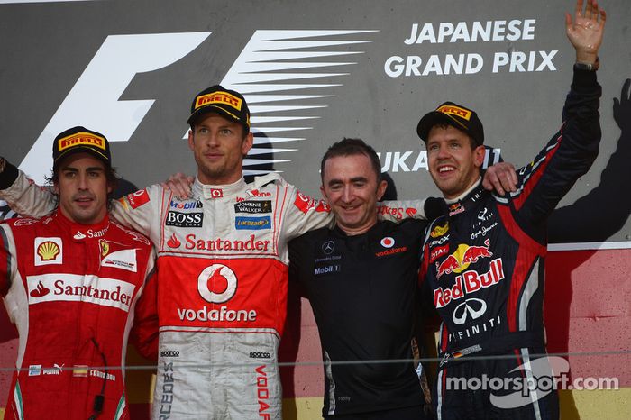 Button y Alonso, como primero y segundo del GP de Japón, acompañan al campeón del mundo de F1 2011, Sebastian Vettel