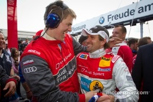 Race winner Markus Winkelhock celebrates with Audi Sport Team Phoenix team members