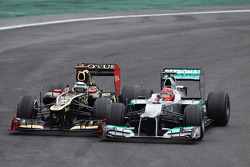 Michael Schumacher, Mercedes AMG F1 and Kimi Raikkonen, Lotus F1 battle for position