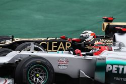 Michael Schumacher, Mercedes AMG F1 and Kimi Raikkonen, Lotus F1 battle for position
