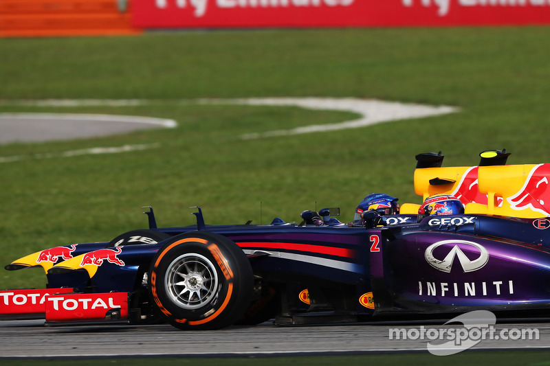 Sebastian Vettel, Red Bull Racing RB9 and team mate Mark Webber, Red Bull Racing RB9 battle for the lead of the race