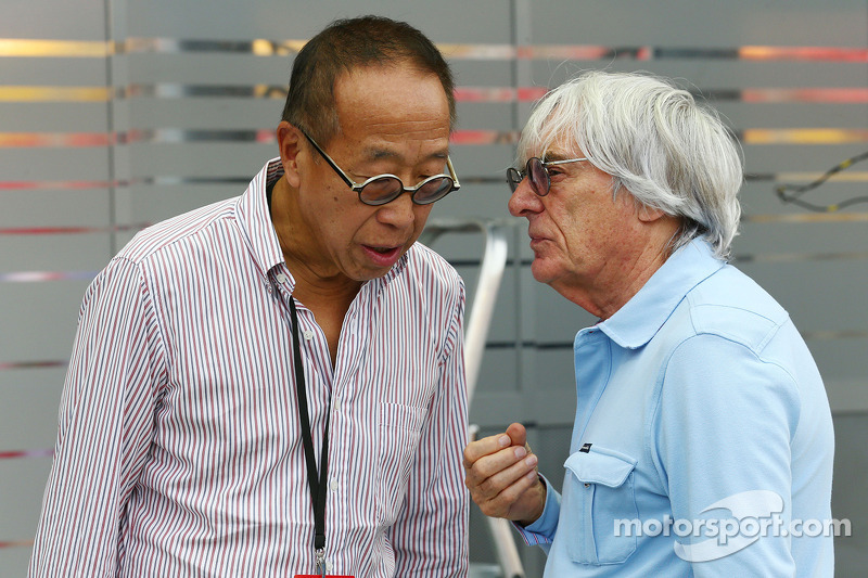 Bernie Ecclestone, CEO Formula One Group, with Ong Beng Seng, Owner Hotel Properties Ltd and Singapo