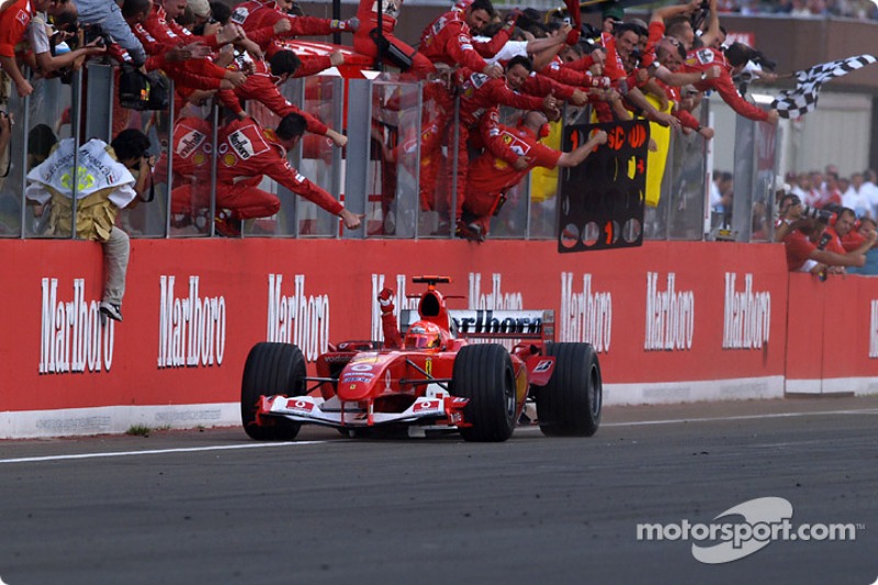 Michael Schumacher takes the checkered flag