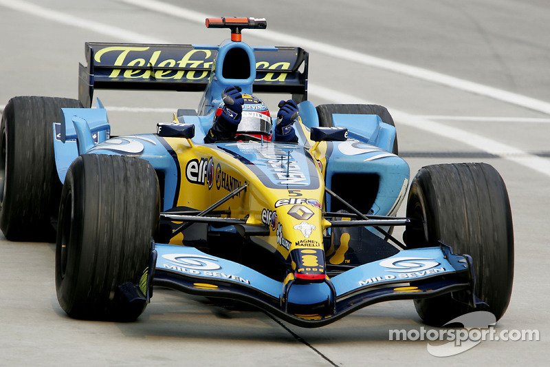 Race winner Fernando Alonso celebrates