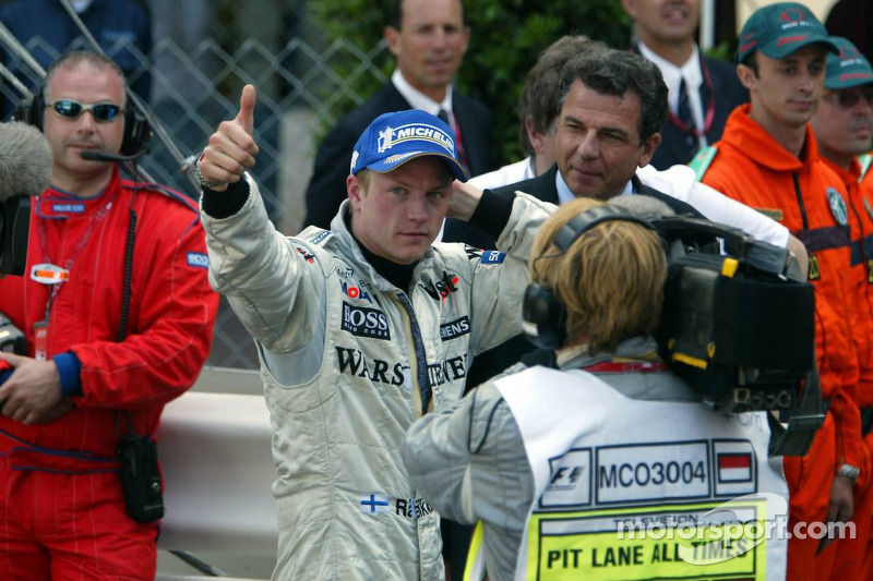 Race winner Kimi Raikkonen celebrates