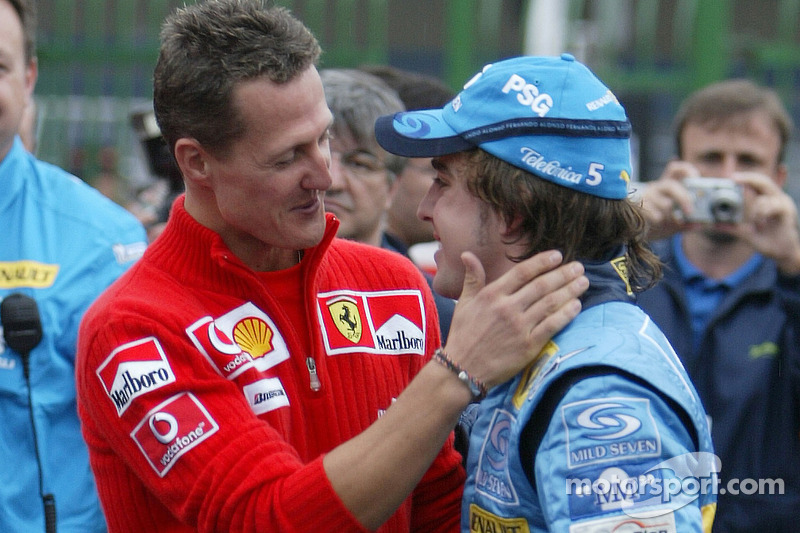 The passing of the crown: Michael Schumacher congratulates 2005 World Champion Fernando Alonso