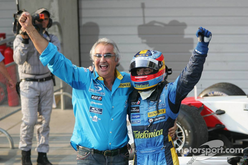 Race winner Fernando Alonso celebrates with Flavio Briatore