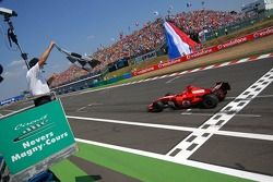 Michael Schumacher takes the checkered flag