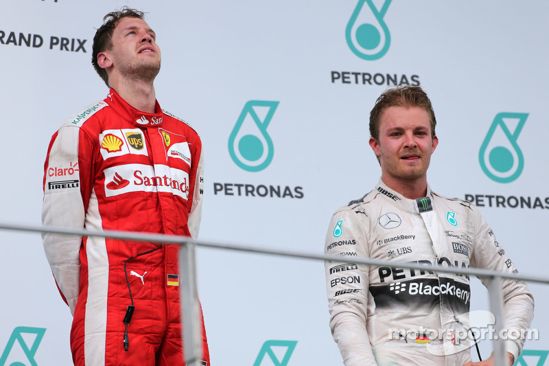 Sebastian Vettel, Scuderia Ferrari y Nico Rosberg, Mercedes AMG F1 Team