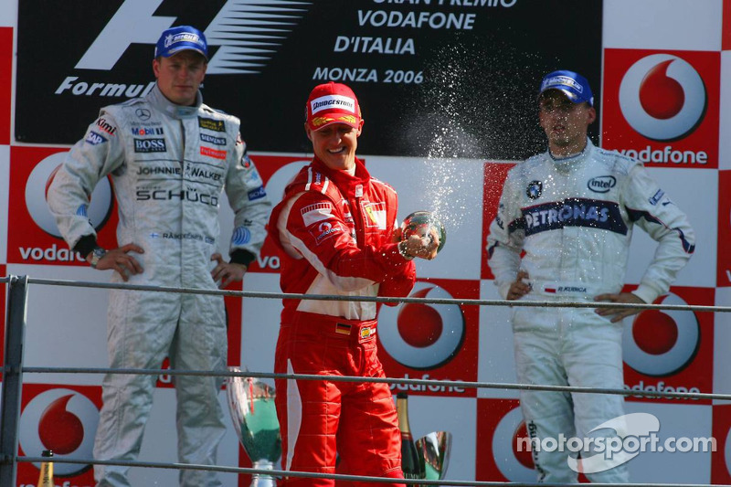 Podium: race winner Michael Schumacher with Kimi Raikkonen and Robert Kubica