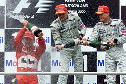 Podium: winner Rubens Barrichello, Ferrari and second place Mika Hakkinen and third place David Coul