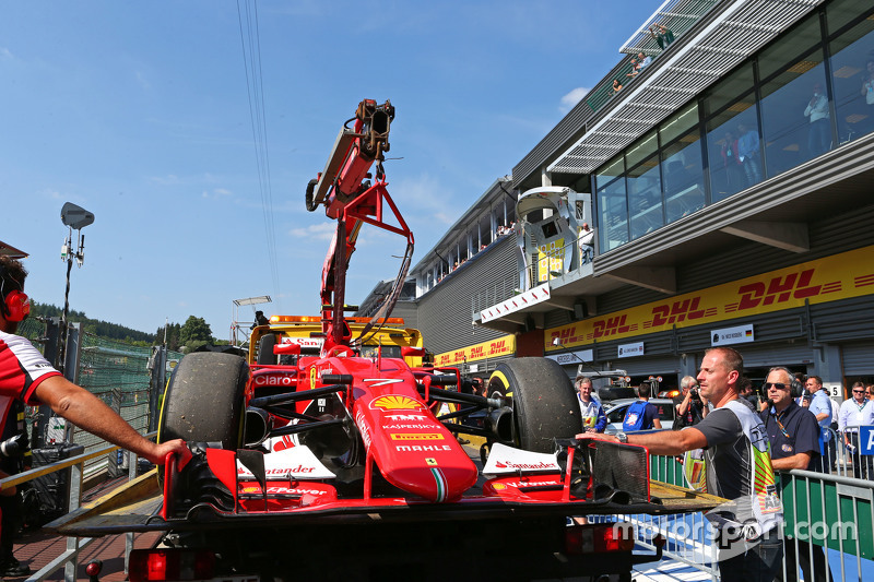 The Ferrari SF15-T of Kimi Raikkonen, Ferrari is recovered back to the pits on the back of a truck a