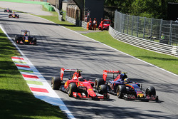 Kimi Raikkonen, Ferrari SF15-T and Carlos Sainz Jr., Scuderia Toro Rosso STR10